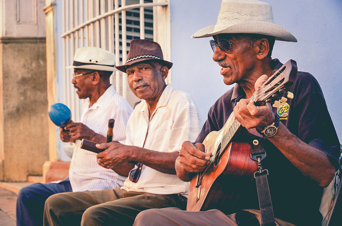 Elderly people playing music with latino instruments